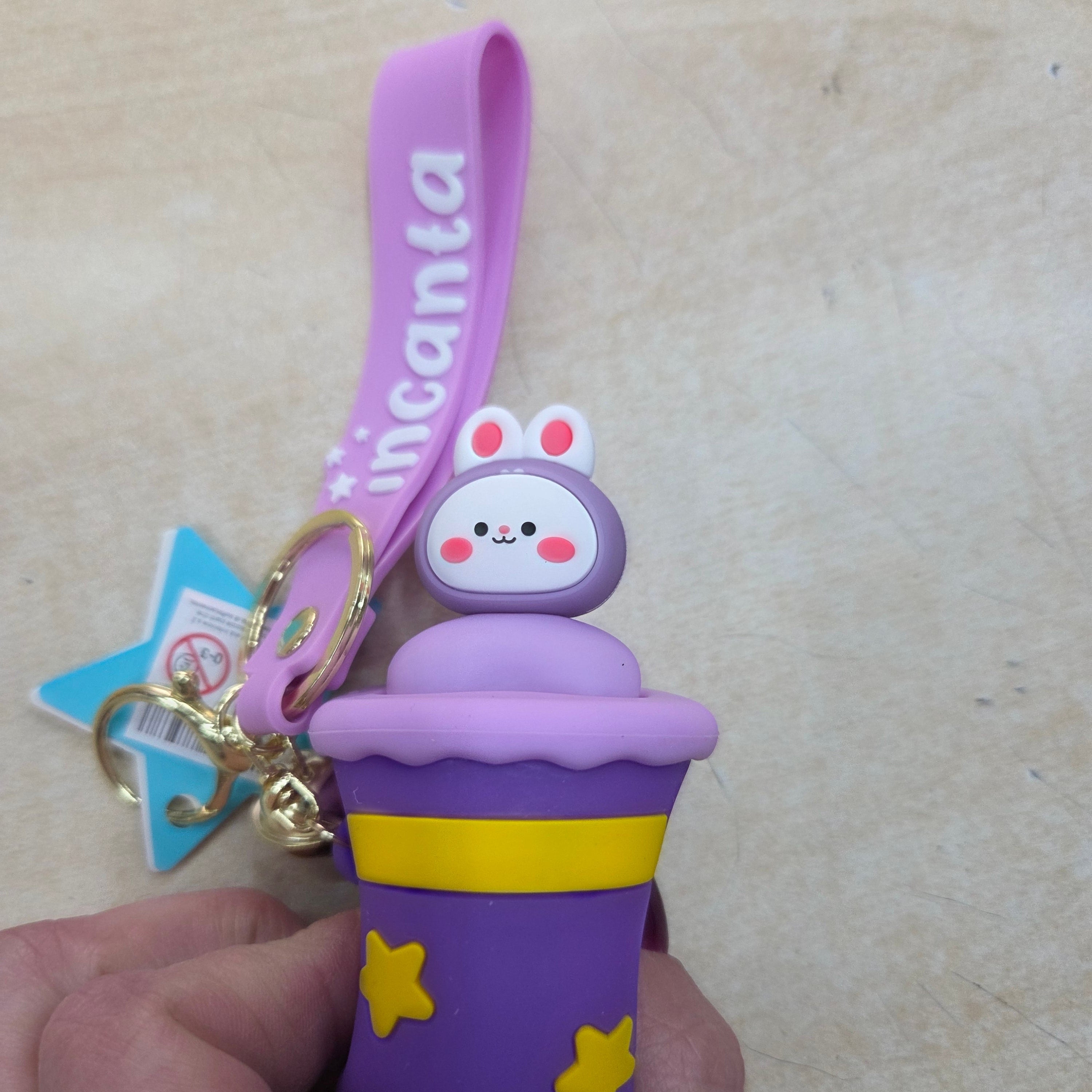 Incanta: Portachiavi in silicone sonnellino nascondino viola lilla giallo