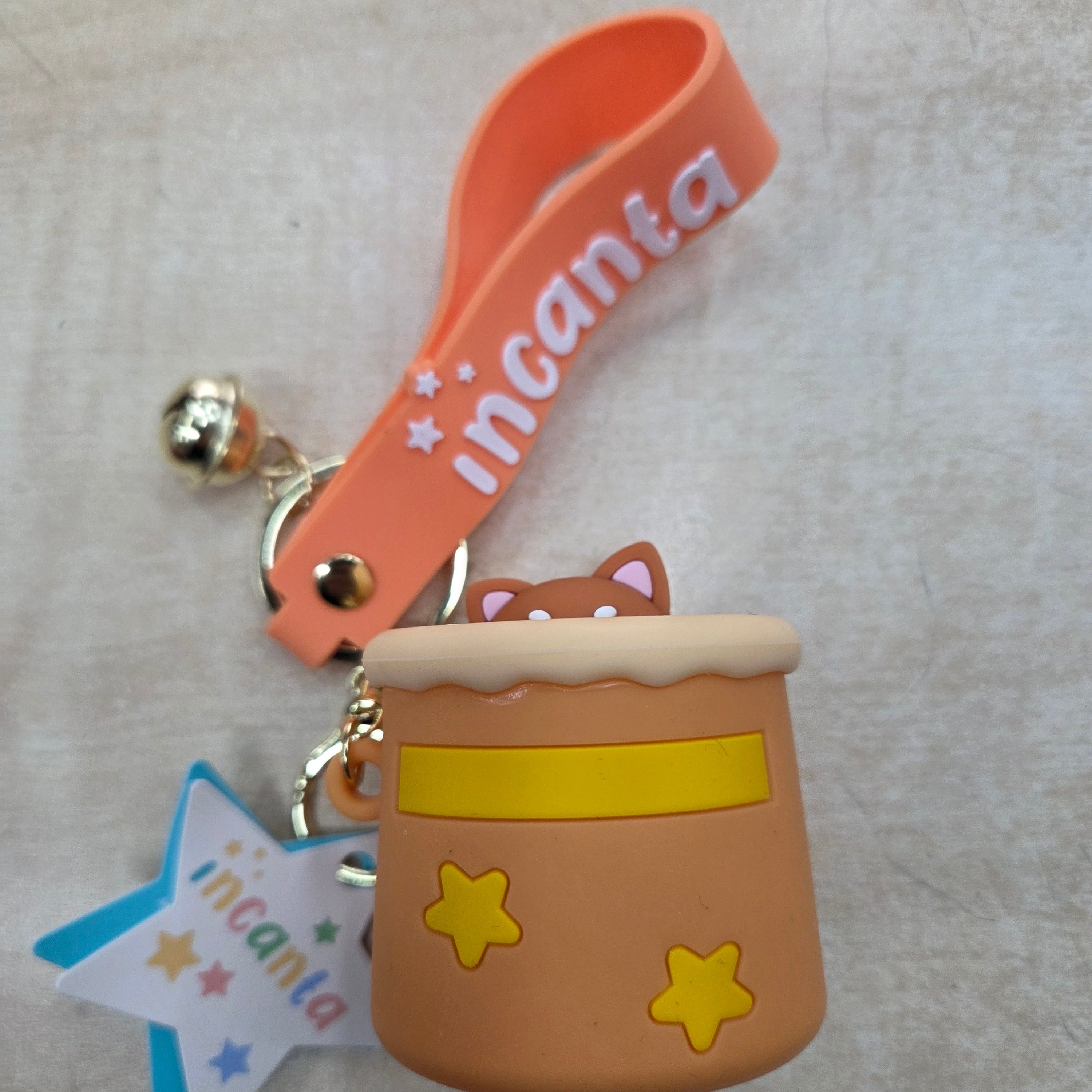 Incanta: Portachiavi in silicone sonnellino nascondino ocra giallo beige