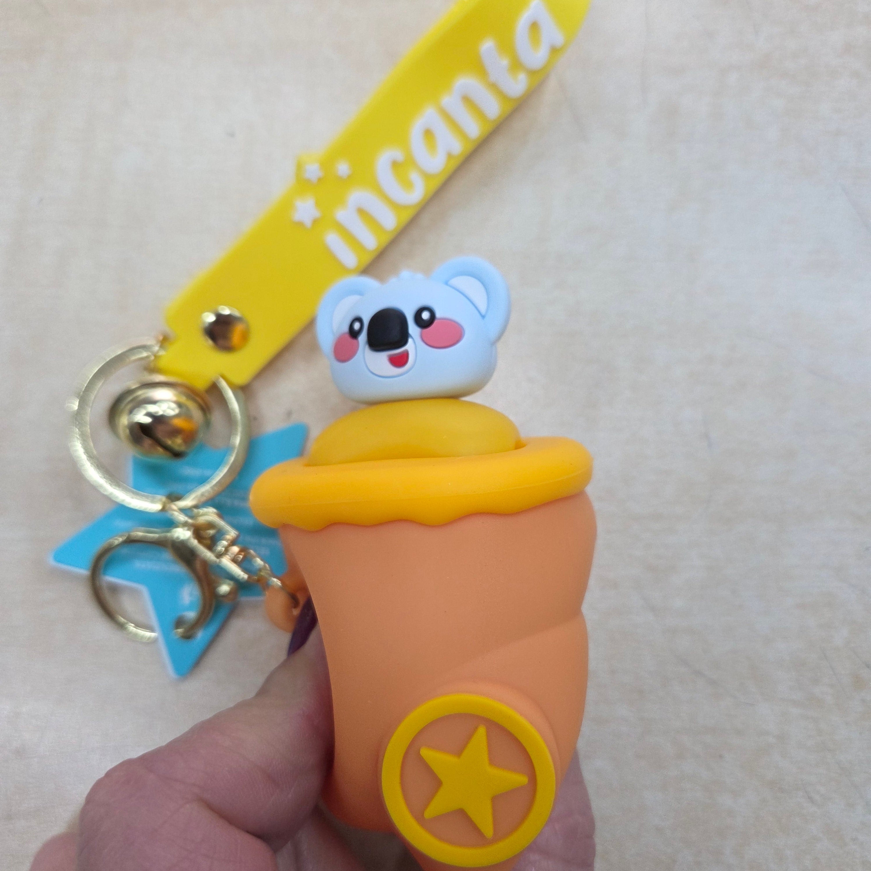 Incanta: Portachiavi in silicone sonnellino nascondino ocra arancio